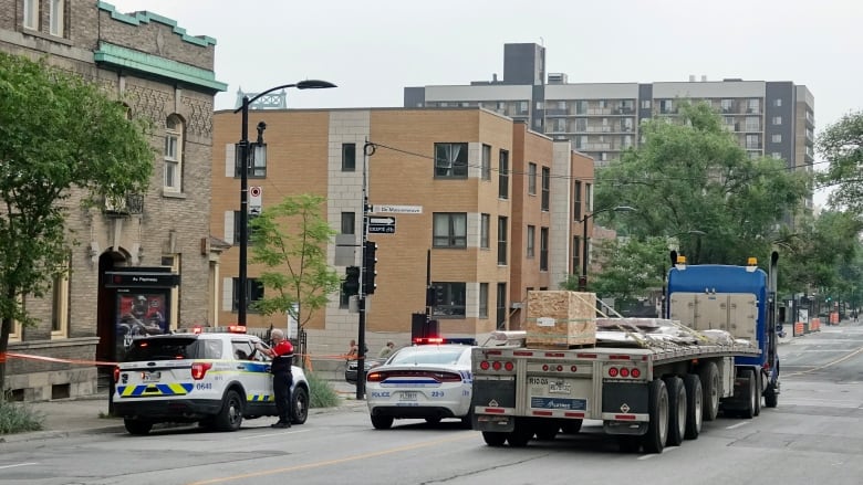 Montreal police at scene of a bicycle/truck crash