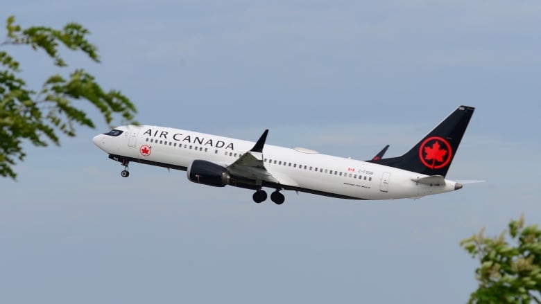 An airplane is seen ascending. 