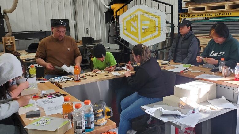 A group of students working around a table