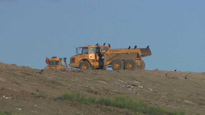 Truck and tractor seen from a distance.