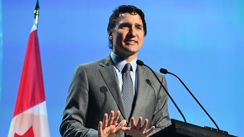 Canadian Prime Minister Justin Trudeau stands at a podium and delivers a speech in Montreal on Wednesday, July 5, 2023.