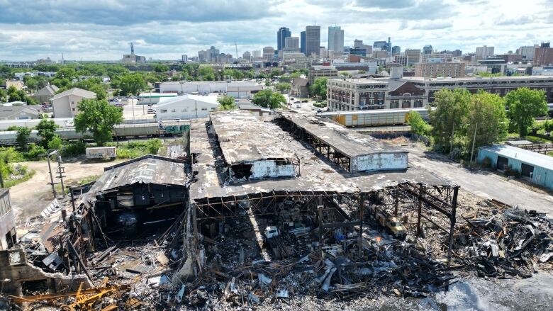 A wide view of a large burned down building. 