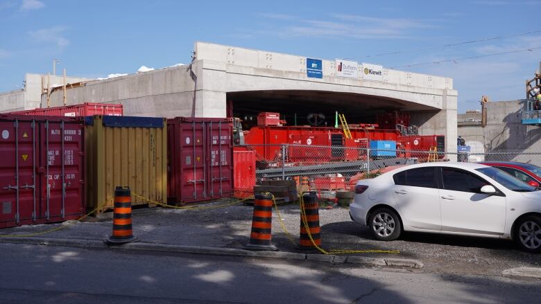 A new highway overpass sits beside a highway.