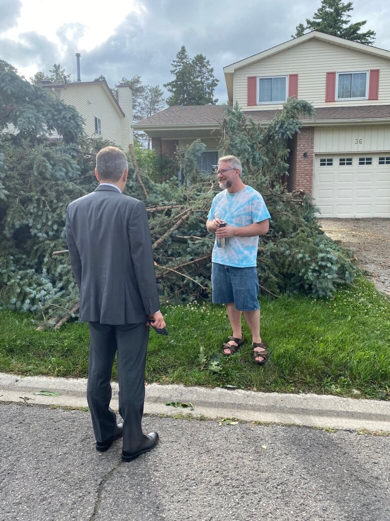 Ottawa Mayor Mark Sutcliffe with resident affected by July 13 2023 tornado