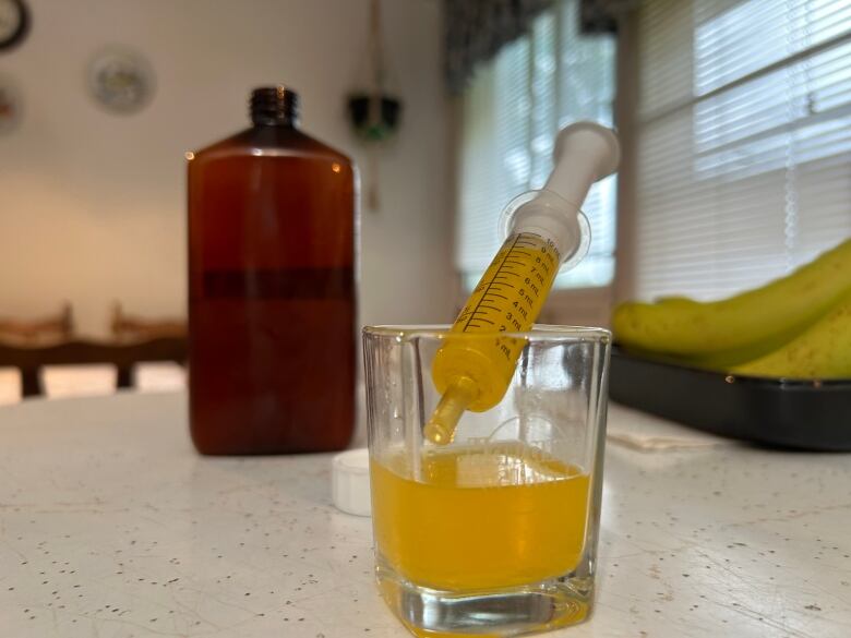 bottle with bright yellow liquid