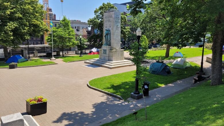 Several tents are shown pitched at Grand Parade outside Halifax City Hall.