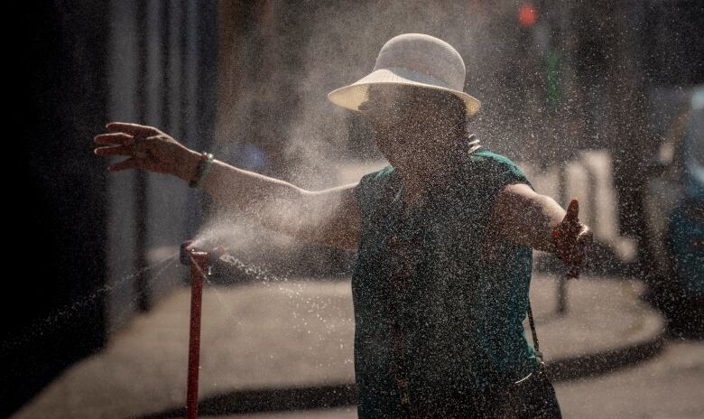 A woman at a misting station. 