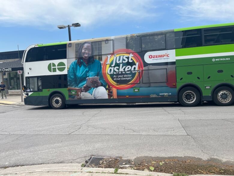 Commuter bus displaying an advertisement for the medication Ozempic. 