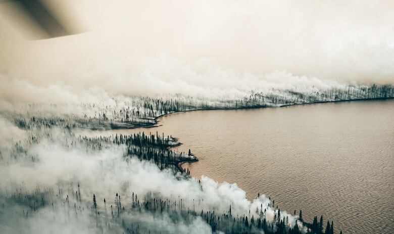 Land up to the edge of a lake burns in northern Quebec 