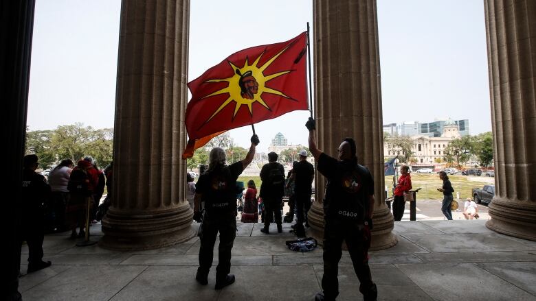 Supporters gather at a rally for provincial funding to search two landfills for the bodies of Mercedes Myron and Morgan Harris and other missing people at the Manitoba Legislature in Winnipeg on June 14, 2023.