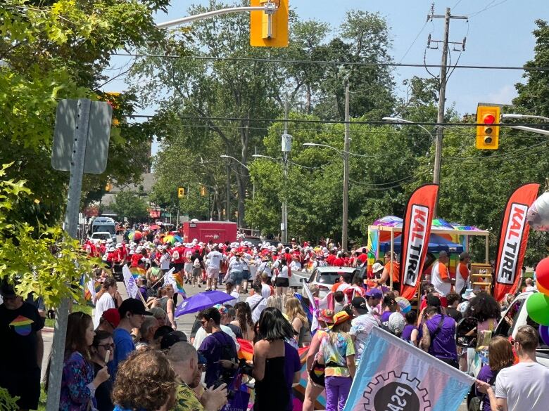 Turnout was in the thousands for London Pride's 2023 parade. People packed the street left to right, with many following the parade all the way to Victoria Park.