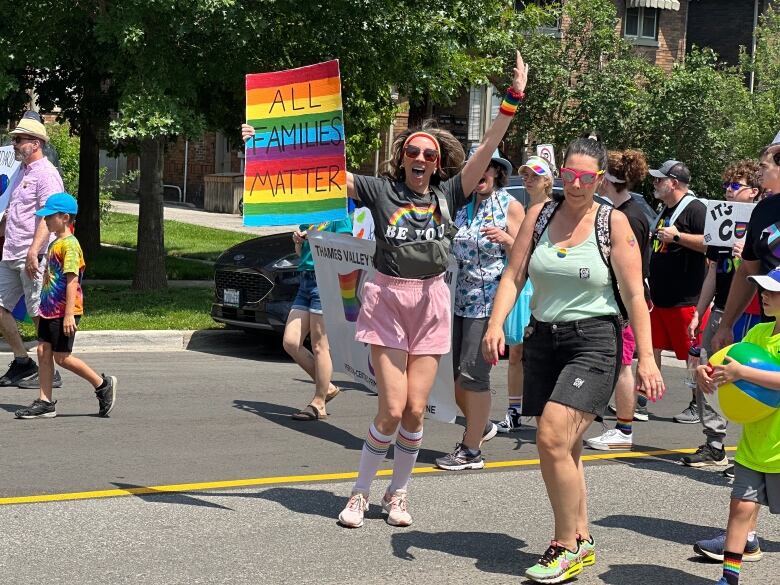 A woman with a sign reading 