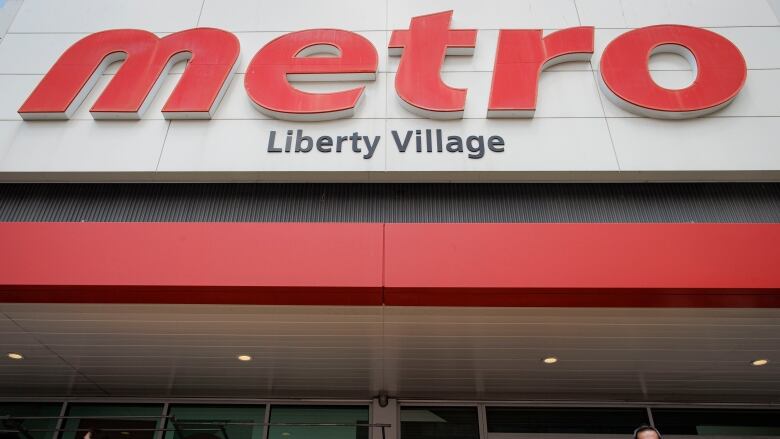 Unionized workers maintain a picket line outside a Metro grocery store, in Toronto, on July 31, 2023.