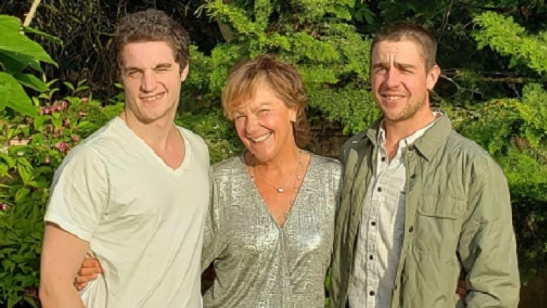 Charley Cragg, right, with mother Genevieve, centre, and brother Max, left. Charley Cragg was working his first day on the job for Wainwright Marine when the tugboat he was on capsized and he drowned.