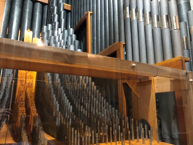 A collection of charcoal grey organ pipes