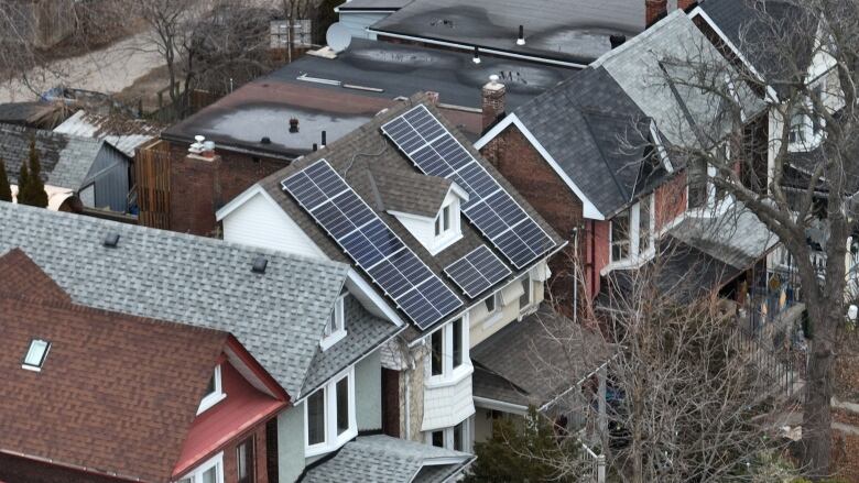 aerial view of home with solar panels on roof