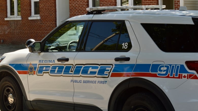 A vehicle with Regina Police markings, including the force's motto: Public Service First.