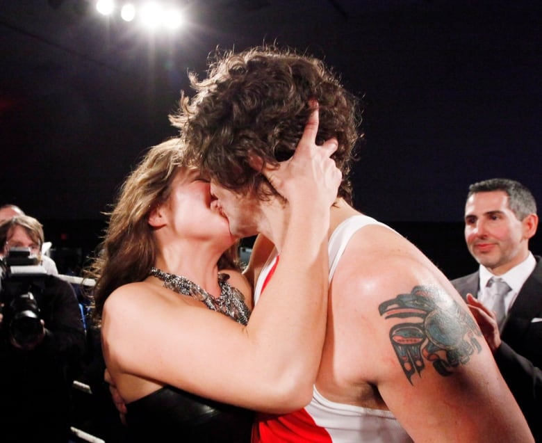 Trudeau kisses Grgoire Trudeau in celebration of his boxing match win on Saturday, March 31, 2012 in Ottawa.