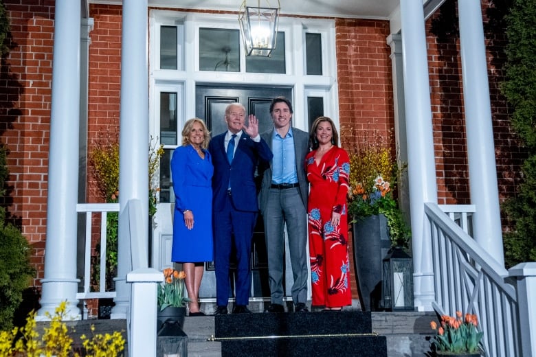 President Joe Biden and first lady Jill Biden pose for members of the media as they arrive to visit with Trudeau and Grgoire Trudeau at Rideau Cottage on March 23, 2023, in Ottawa.