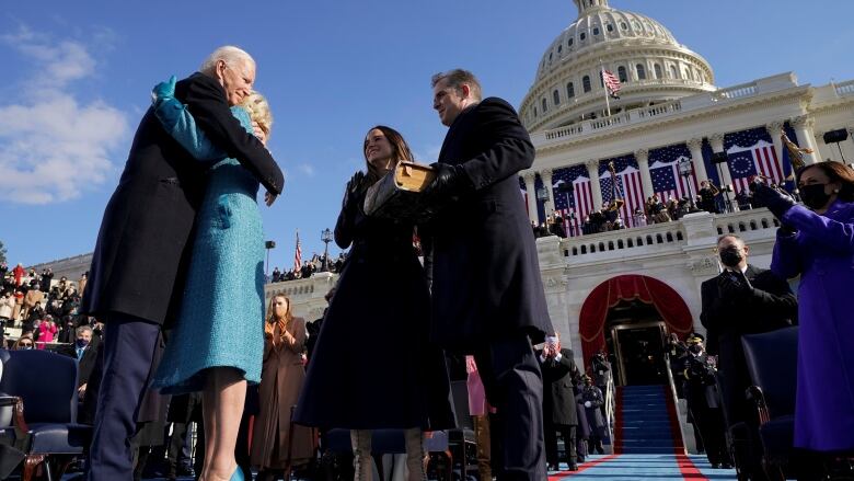 Joe Biden takes oath of office outside Capitol while family looks on