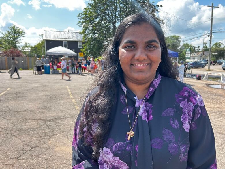 Sandra Sunil, who helped start the project in Charlottetown, is pictured wearing a purple shirt with flowers on it. 