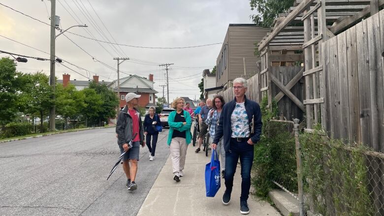 Armed with food, water and naloxone kits, some Vanier residents participated in the inaugural 'Good Neighbours safety walk', Tuesday night. 