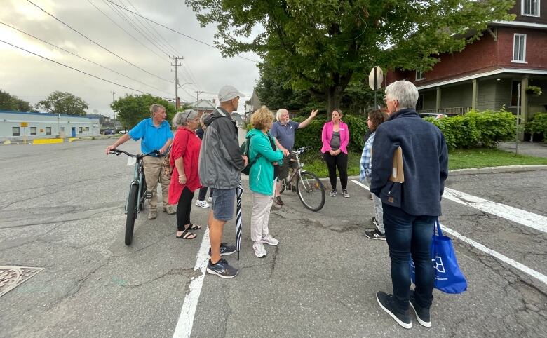 Vanier residents who came out for the 'Good Neighbours' safety walk discuss issues in their neighbourhood. 