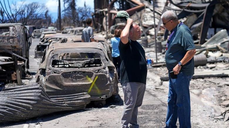 Hawaii's governor tours the town in Maui hit by a wildfire.