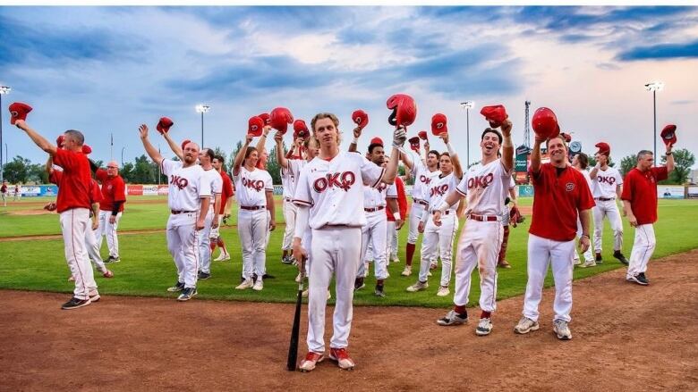 Okotoks Dawgs players salute fans during an earlier game in their 2023 playoff run.