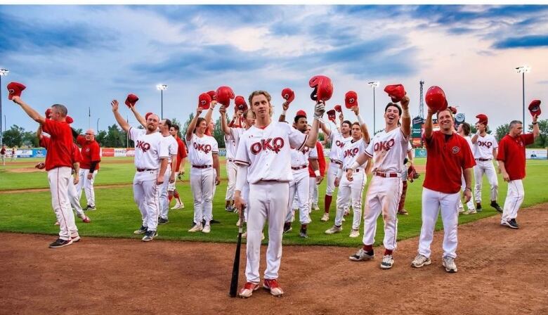 Okotoks Dawgs players salute fans during an earlier game in their 2023 playoff run.