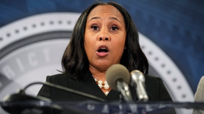 Fulton County District Attorney Fani Willis speaks in the Fulton County Government Center during a news conference, Monday, Aug. 14, 2023, in Atlanta. Donald Trump and several allies have been indicted in Georgia over efforts to overturn his 2020 election loss in the state. (AP Photo/John Bazemore)