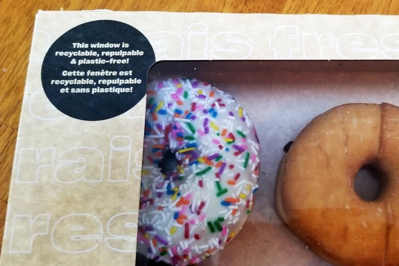 A box of doughnuts with a plastic-free plastic window.