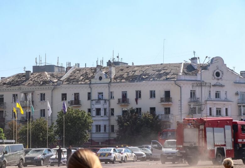 Fire trucks and police cars near the site of a Russian missile strike.