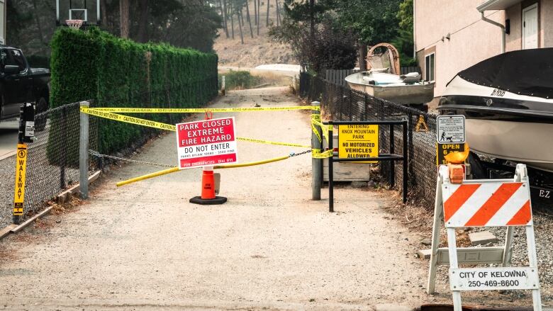 A closed path in the aftermath of wildfire.