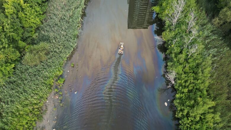 Aerial (drone) images of the run off from the industrialfire in Etobicoke along Mimico Creek now appears to be leaching into the Humber Bay and into Lake Ontario. There is a pond of beige sludge the size of a city pool they're trying to clean up. There is a massive cleanup effort underway. They've closed the Humber Bay Park West Parking lot and boat ramp and brought in a lot of heavy machinery.