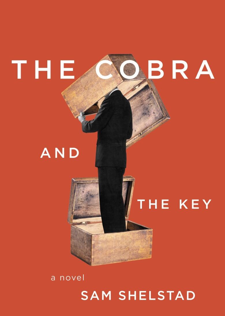 An orange book cover with a picture of a man standing in a wooden trunk with another wooden trunk over his head.