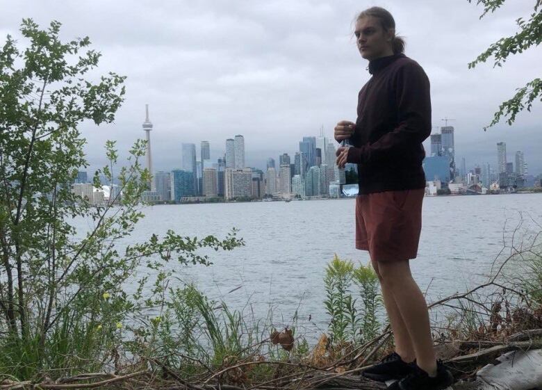 Horenych, 17, visits the Toronto Islands with the CN Tower in the background during his two-month stay in the GTA, before deciding to go home.