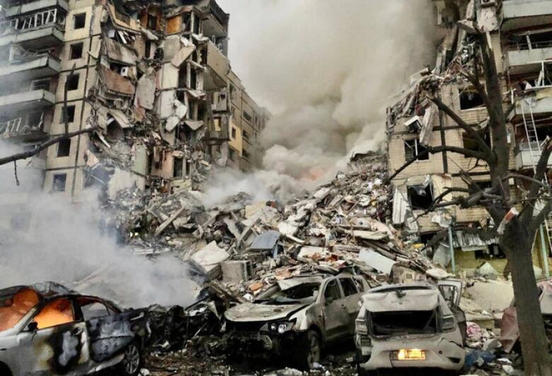 More than 70 apartments and several cars were destroyed by a Russian missile in Dnipro, Ukraine, killing 46 people on Jan. 14, 2023. 