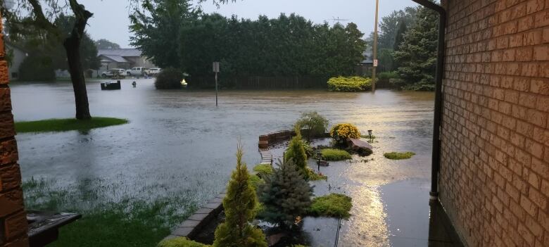 Neighbourhood flooding in the area of Harrow is shown.