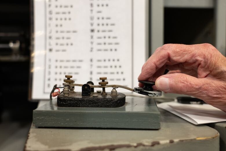 Barbers hand on the morse code instrument