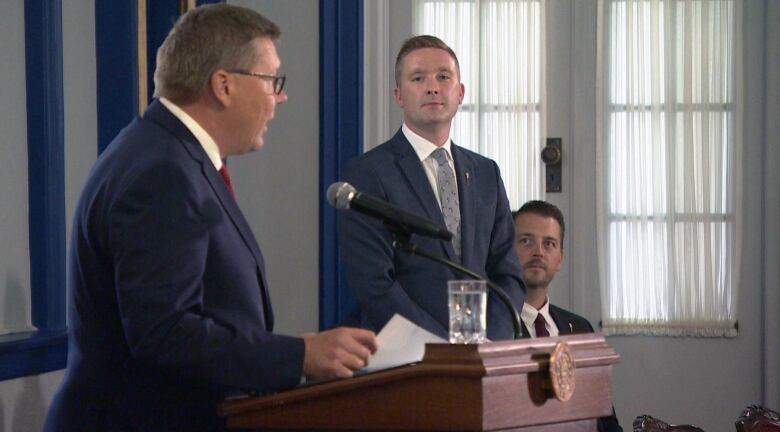 New Minister of Education Jeremy Cockrill (right) looks on as Premier Scott Moe announces his appointment to cabinet. 