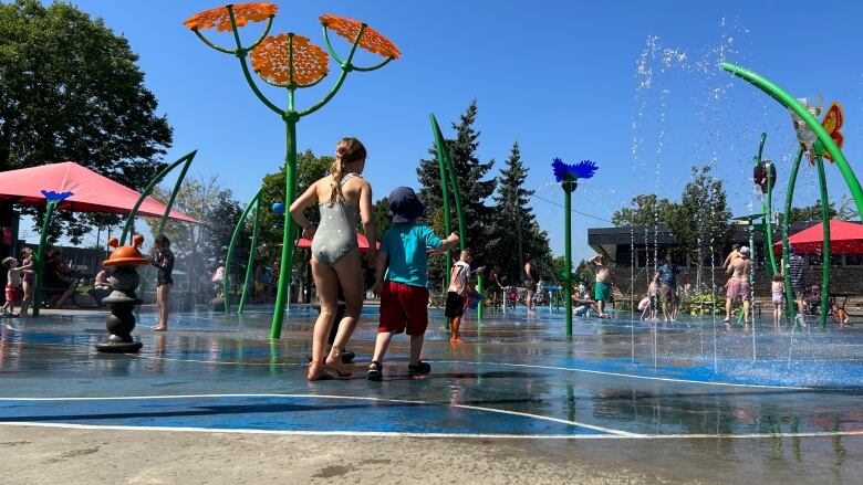 Children running through splash pads