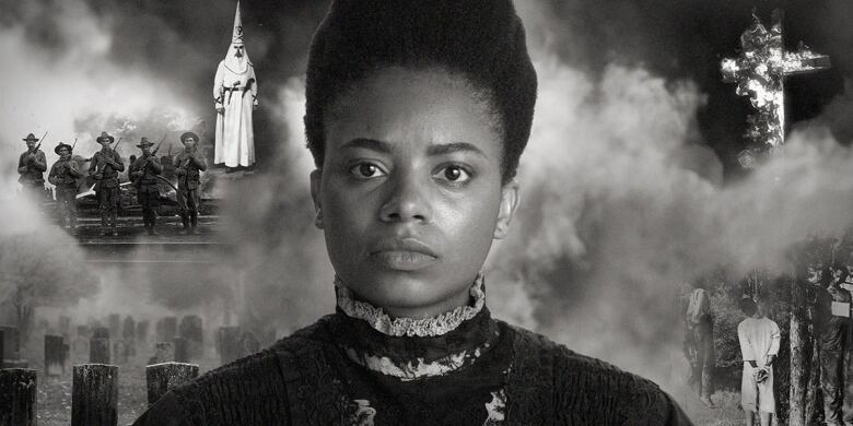 A black and white movie still of a young Black woman with fog behind her and images of soldiers, graves and a burning cross.