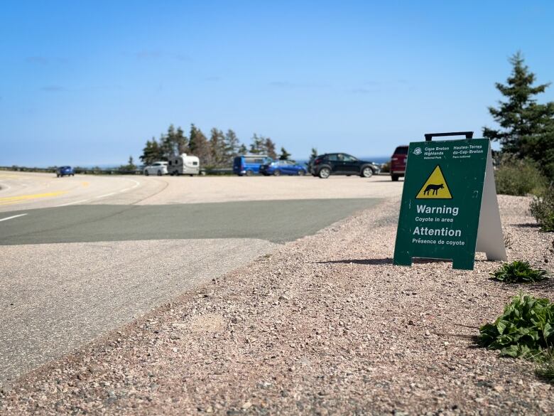 A sign warns about coyotes in the area.