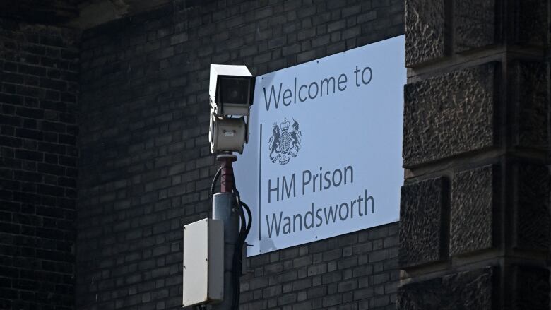 A CCTV camera is seen at the walls of HM Prison Wandsworth in south London.