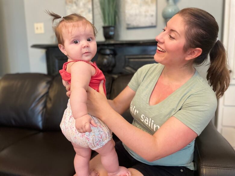 Alicia Chiasson holding baby.