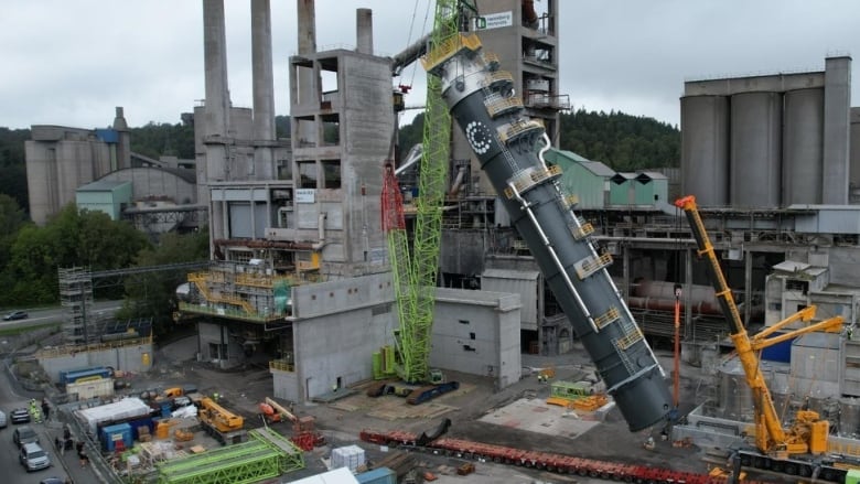 A piece of industrial equipment is pictured being installed at a cement plant in Brevik, Norway.