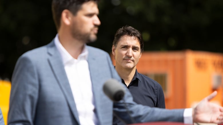 Prime Minister Justin Trudeau watches Minister of Housing Sean Fraser as he speaks at the construction site of an affordable housing project in London, Ont. on Wednesday, September 13, 2023.