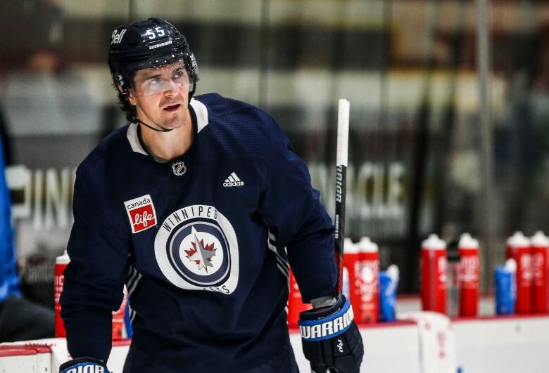 Hockey player on ice during practice.