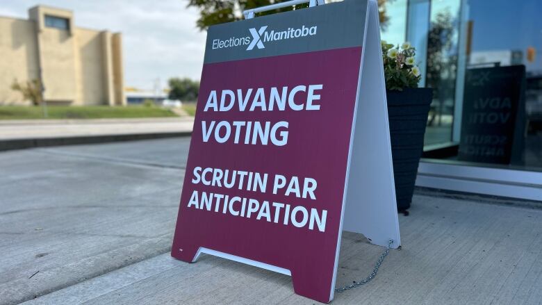 An Elections Manitoba sandwich board sign that says 